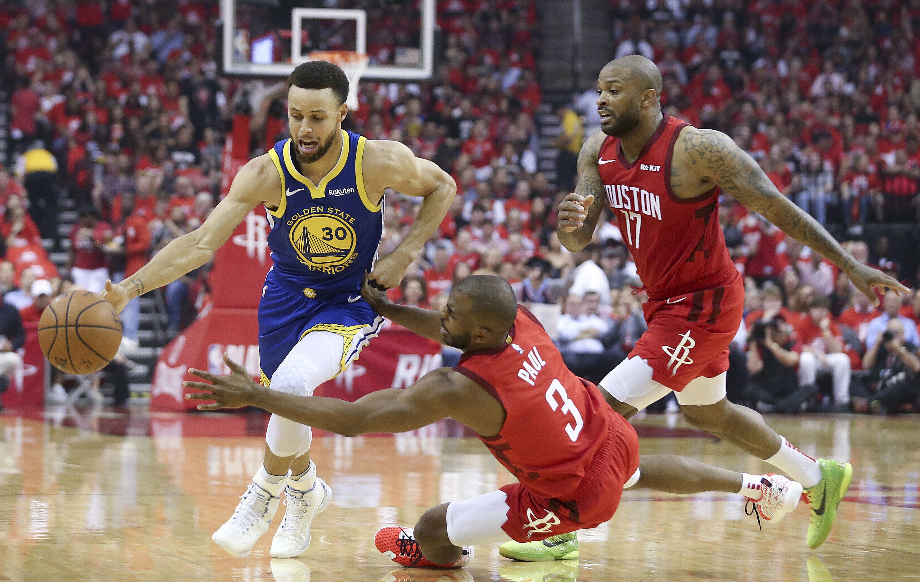 CP3 and P.J. Tucker of the Rockets defend Warriors guard Stephen Curry
